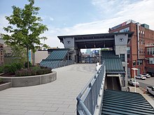 An elevated deck leading to a footbridge at a railway station