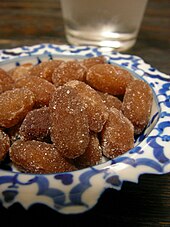 Peanut amanatto. Amanatto is a traditional Japanese confectionery that is made of azuki or other beans, covered with refined sugar after simmering with sugar syrup and drying. Peanut Amanatto.jpg