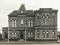 The first Town Hall showing trophy gun and 1892 Frederick St side addition, 11 September 1921.