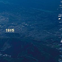 The album cover shows an aerial photograph of an American city, washed with a distinct blue hue. The band name and album title are visible, relatively small, halfway up the left side of the art.