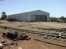 The depot built by the society at Peterborough West; trackwork was recovered from abandoned sidings Steamtowndepot2006.jpg