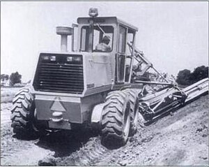 Dresser 830 grader grading a bank. The 27,800-pound grader was formerly the Galion A-450E, but was renumbered when its parent company Dresser Industries temporarily dropped the Galion name in 1986. Dresser 830.jpg