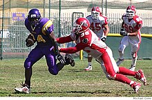 Tyrone McGraw, '06, in a football game for the Crusaders against Burlingame Tyronemcgraw-MICHAELCONTI.jpg