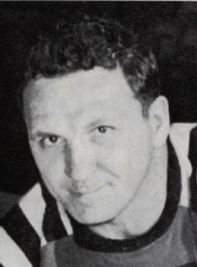 Black and white photo of Lallo in a hockey uniform and equipment
