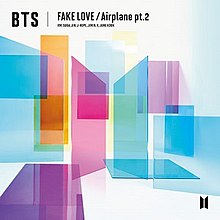 Several translucent colorful shapes overlap one another on a white background. The words "BTS Fake Love / Airplane Pt. 2 appear in the top left."