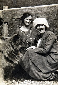 Two women and a dog