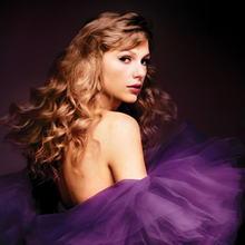 A photo of Taylor Swift looking back over her shoulders in a purple dress