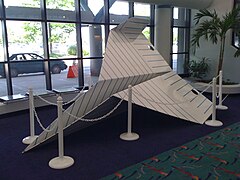 Artwork depicting a paper airplane in the terminal