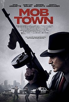 Poster showing a man in a fedora looking over his shoulder and holding a tommy-gun as three police officers approach in the background