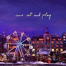 Picture of a city and Ferris wheel getting snowed.