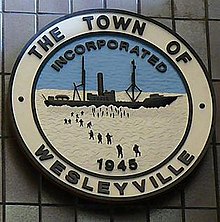 A wood carving of the town seal of Wesleyville on display at Memorial University of Newfoundland. Wesleyville.JPG