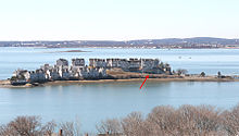 Spinnaker Island, looking westward, with World War II era gun position indicated by arrow. Spinnaker -Isl-With Bunker.jpg