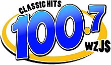 Logo before 99.1 translator sign on WZJS ClassicHits100.7 logo.jpg