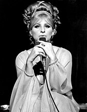 Black-and-white photo of Barbra Streisand singing