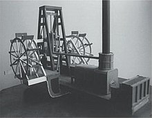 Model of a crosshead or "square" engine, showing location of engine cylinder above the crankshaft; also piston rod, crosshead, connecting rods and paddlewheels