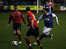 Hyde (in red) play Stalybridge in 2012