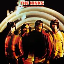 The Kinks stand facing the camera while enclosed in hazy orange-brown concentric circles