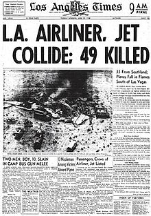 Newspaper front-page headline states "L.A. AIRLINE, JET COLLIDE; 49 KILLED." An aerial photo of the crash site shows emergency vehicles surrounding fragmented, burned wreckage from which dark smoke rises.
