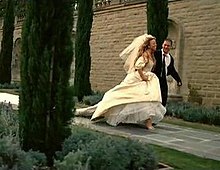 In the music video, Carey wore her wedding dress from her nuptials to Tommy Mottola in 1993. She is seen running from the altar, alongside her lover (Wentworth Miller), in the video's climactic scene. MC WBT wedding.jpg