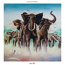 A herd of elephants over a patch of fog. Elvis Costello and the Attractions reads at the top, while Armed Forces reads at the bottom.