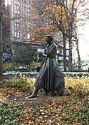 The statue, boulder, and footstone, sculpted by Penelope Jencks.