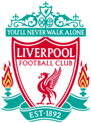 The words "Liverpool Football Club" are in the centre of a pennant, with flames either side. The words "You'll Never Walk Alone" adorn the top of the emblem in a green design, "EST 1892" is at the bottom.