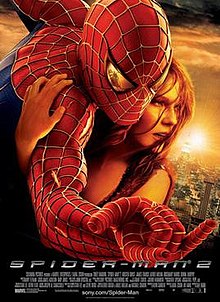 Against a New York City background, Spider-Man hugs Mary Jane Watson, with a reflection of Doctor Octopus in his eye as he shoots a web.