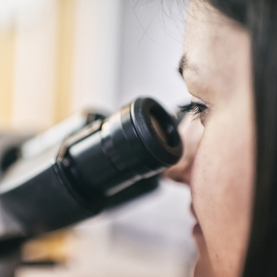 A girl and a microscope