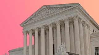 The Supreme Court building with a pink sky