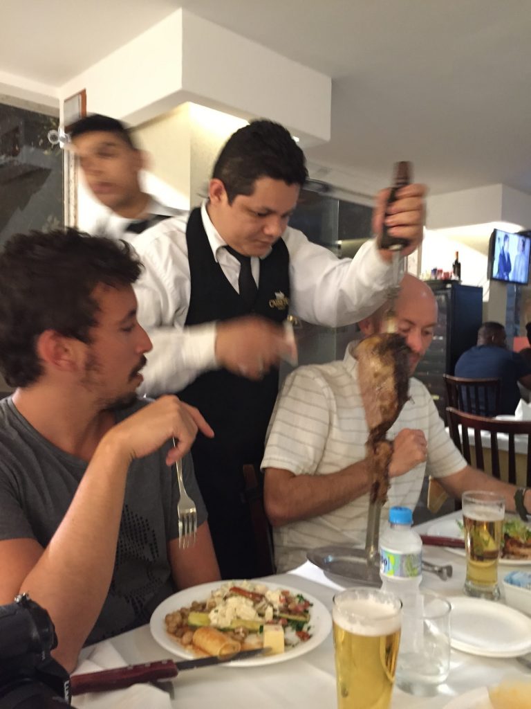 Men eating meat at the churrascaria