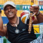 A local gentleman plays a berimbau on the Escadaria Selarón