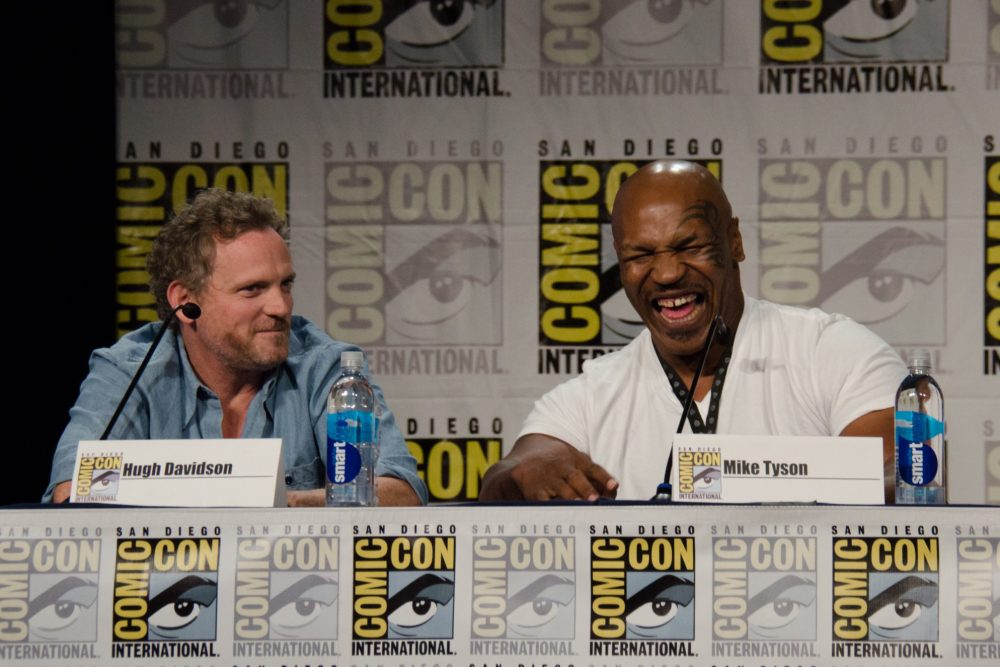 Hugh Davidson, left, and Mike Tyson attend the "Mike Tyson Mysteries" panel on Day 2 of Comic-Con International on Friday, July 25, 2014, in San Diego.(Photo by Tonya Wise/Invision/AP)