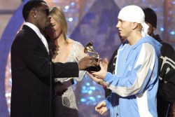 Sean "P. Diddy" Combs and Kim Cattrall present a GRAMMY award to Eminem for Best Rap Album  (Photo by Michael Caulfield/WireImage)