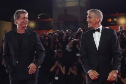 VENICE, ITALY - SEPTEMBER 01: Brad Pitt and George Clooney attend the "Wolfs" red carpet during the 81st Venice International Film Festival on September 01, 2024 in Venice, Italy. (Photo by Vittorio Zunino Celotto/Getty Images)