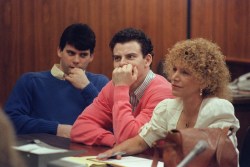 Erik Menendez (C) and his brother Lyle (L) are pictured, on August 12, 1991 in Beverly Hills. They are accused of killing their parents, Jose and Mary Louise Menendez of Beverly Hills, Calif. AFP PHOTO MIKE NELSON (Photo by MIKE NELSON / AFP) (Photo by MIKE NELSON/AFP via Getty Images)