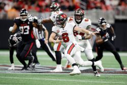 ATLANTA, GEORGIA - DECEMBER 10: Baker Mayfield #6 of the Tampa Bay Buccaneers runs the ball during the first quarter against the Atlanta Falcons at Mercedes-Benz Stadium on December 10, 2023 in Atlanta, Georgia. (Photo by Alex Slitz/Getty Images)