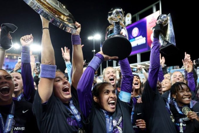 KANSAS CITY, MISSOURI - NOVEMBER 23:  Orlando Pride players celebrate after defeating the Washington Spirit 1-0 in the NWSL 2024 Championship Game at CPKC Stadium on November 23, 2024 in Kansas City, Missouri. (Photo by Jamie Squire/Getty Images)