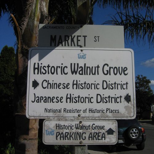 Market Street sign with Historic Walnut Grove directory sign underneath