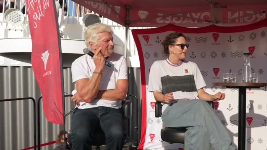 Raygun shows Sir Richard Branson how to breakdance on Virgin Voyages cruise