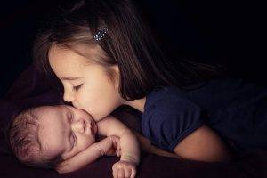 Girl Child Kiss New Born Baby