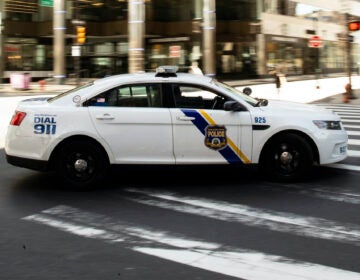 A police officer drives in Philadelphia