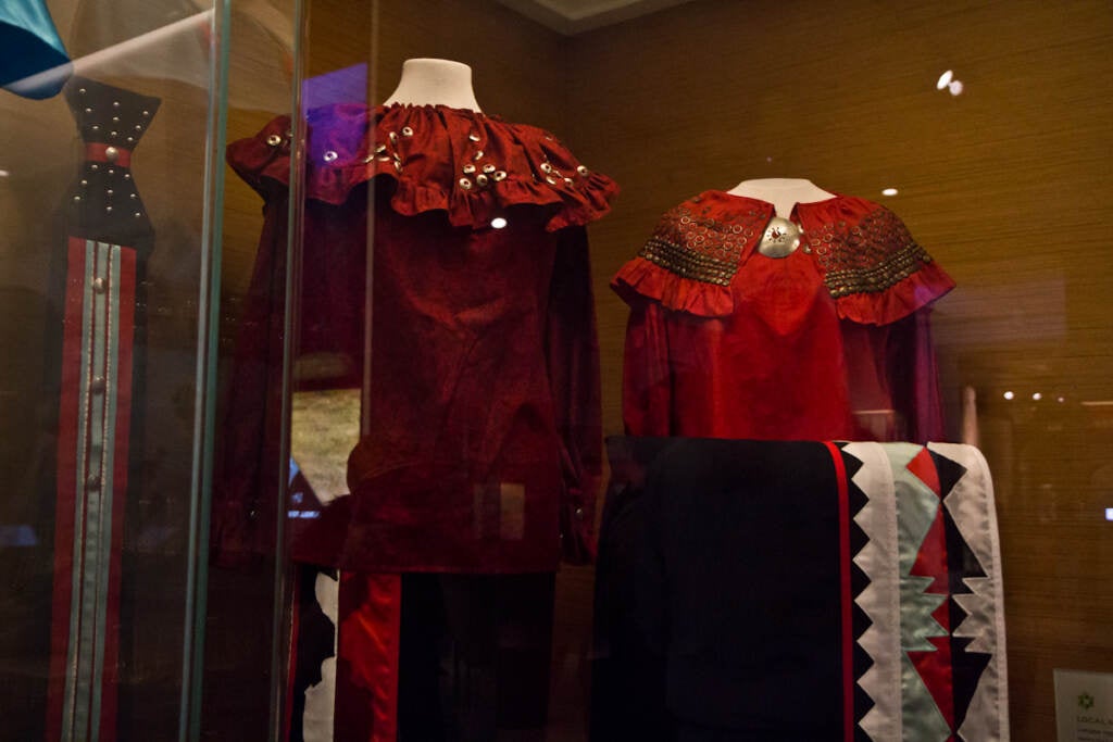 A contemporary Lenape Pow Wow dress (left) and a similar dress for a celebration