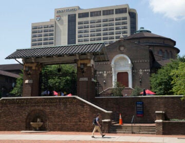 A man walks past the The Penn Museum, part of the University of Pennsylvania