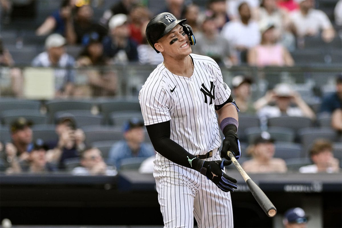 New York Yankees outfielder Aaron Judge (99) reacts after hitting a deep fly ball for an out during the ninth inning against the Tampa Bay Rays at Yankee Stadium.