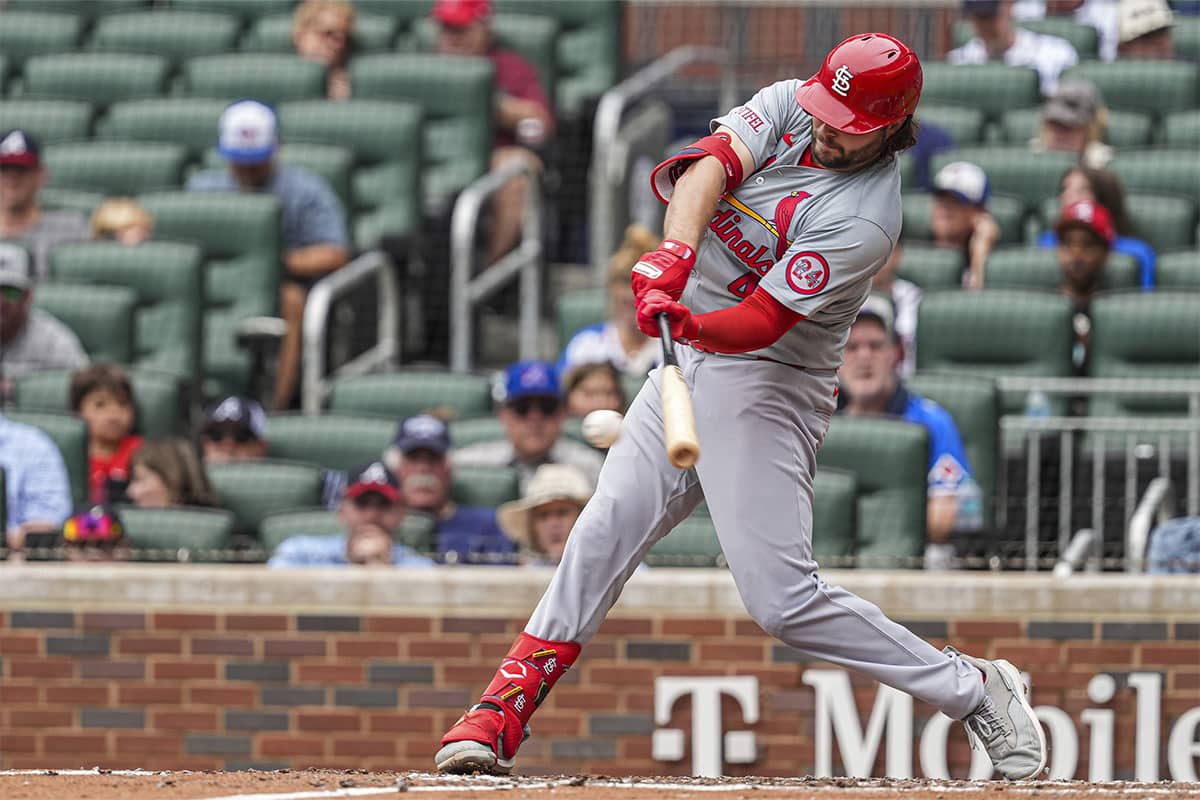 St. Louis Cardinals left fielder Alec Burleson (41) singles to drive in a run against the Atlanta Braves during the sixth inning at Truist Park.