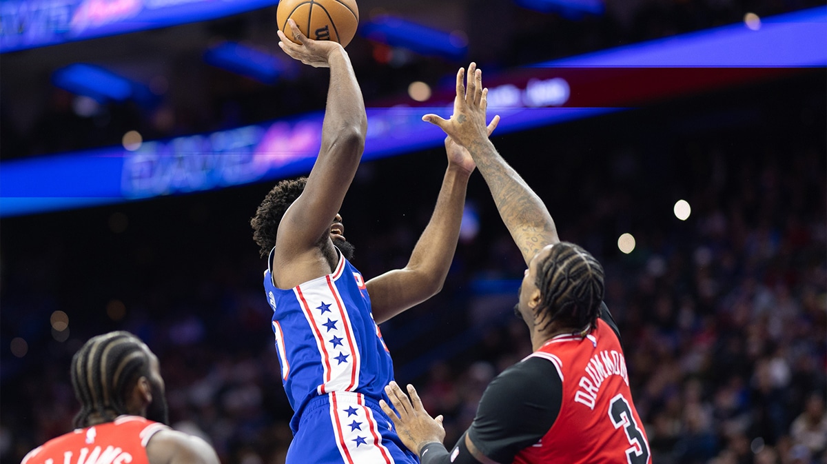 Philadelphia 76ers center Joel Embiid (21) shoots against Chicago Bulls center Andre Drummond (3) during the first quarter at Wells Fargo Center.