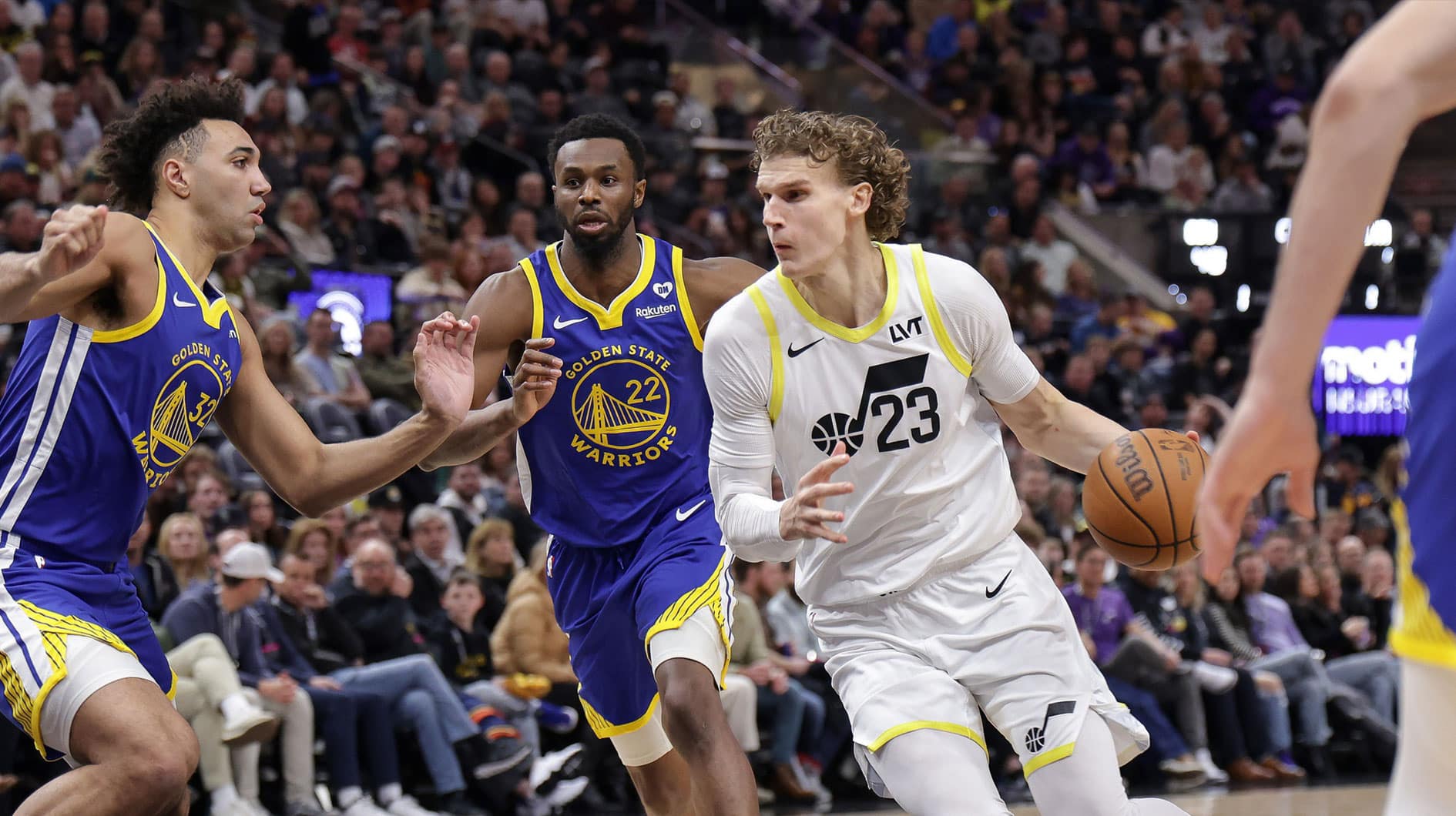 Utah Jazz forward Lauri Markkanen (23) dribbles as Golden State Warriors forward Trayce Jackson-Davis (32) defends during the second quarter at Delta Center.