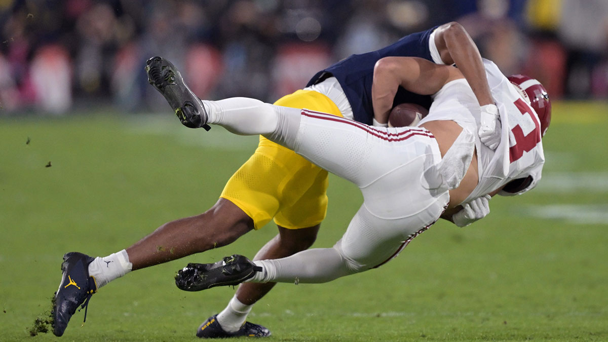 Alabama Crimson Tide wide receiver Jermaine Burton (3) is tackled by Michigan Wolverines defensive back Keon Sabb (3) during the second half in the 2024 Rose Bowl college football playoff semifinal game at Rose Bowl.