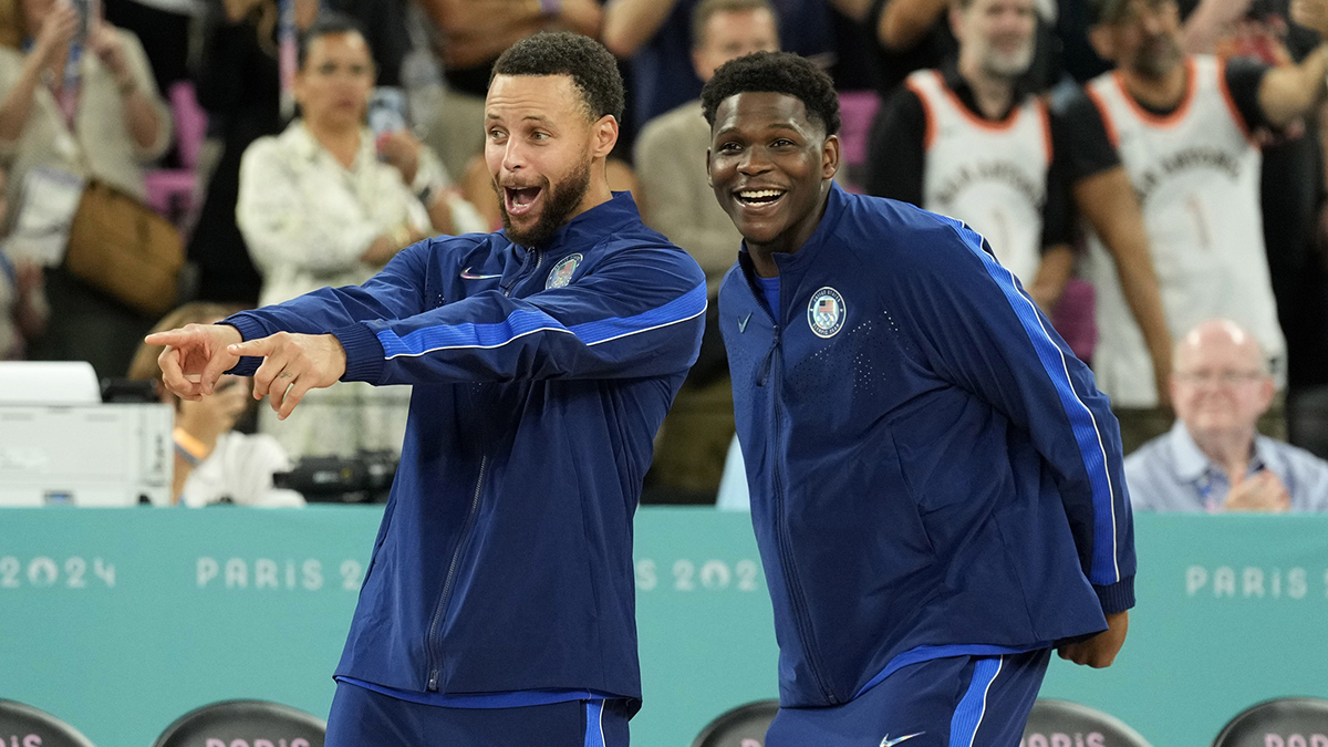 United States shooting guard Stephen Curry (4) and guard Anthony Edwards (5) celebrate after defeating France in the men's basketball gold medal game during the Paris 2024 Olympic Summer Games at Accor Arena. 