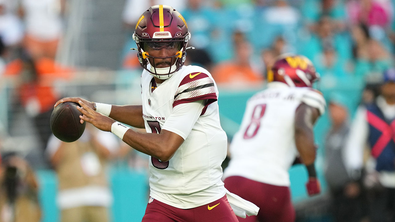 Washington Commanders quarterback Jayden Daniels (5) drops back to pass against the Miami Dolphins during the first quarter at Hard Rock Stadium. 